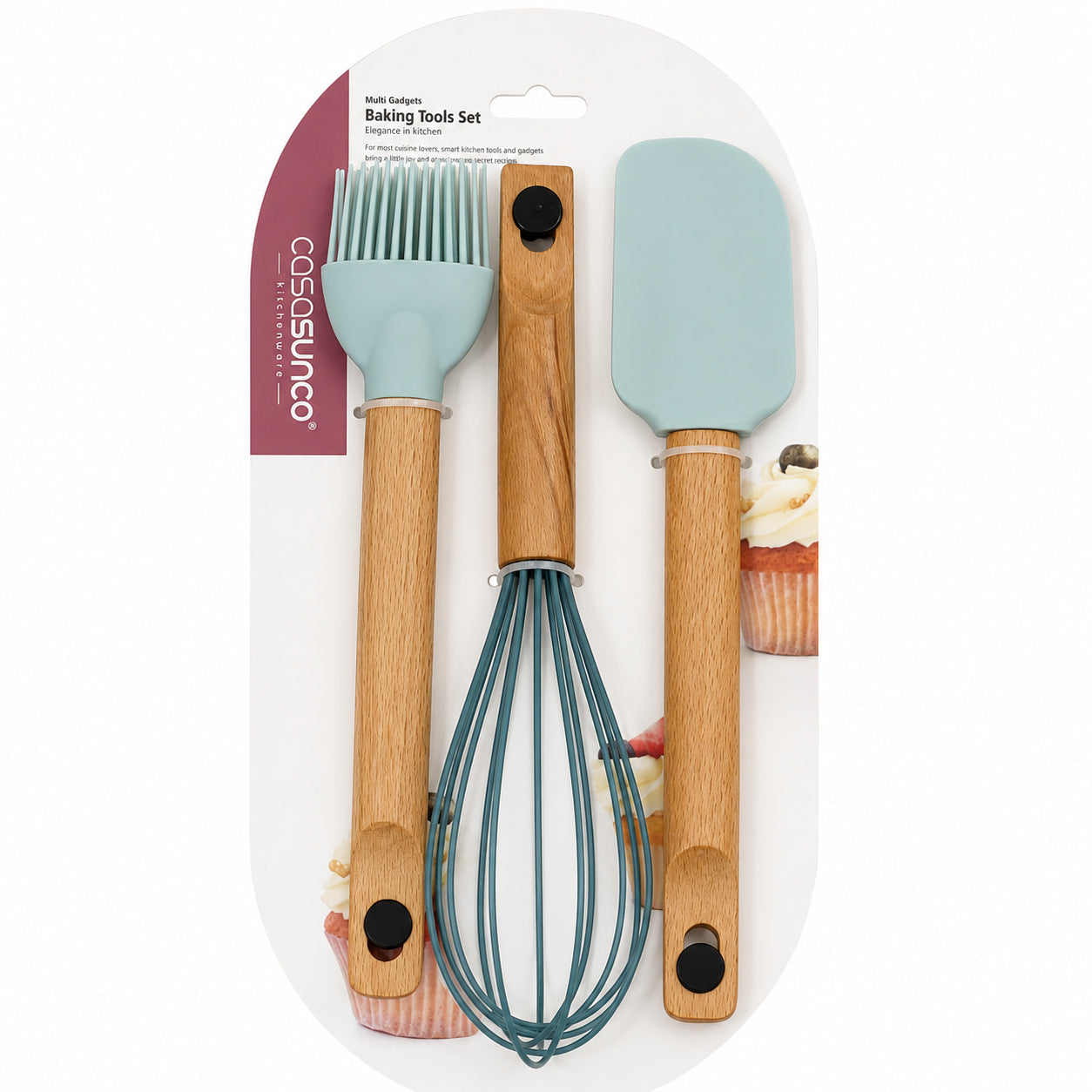 A 3-piece baking tools set by Cosasunco, featuring a wooden-handled brush, whisk, and spatula with light blue silicone heads, packaged on a white card with a pink brand label.