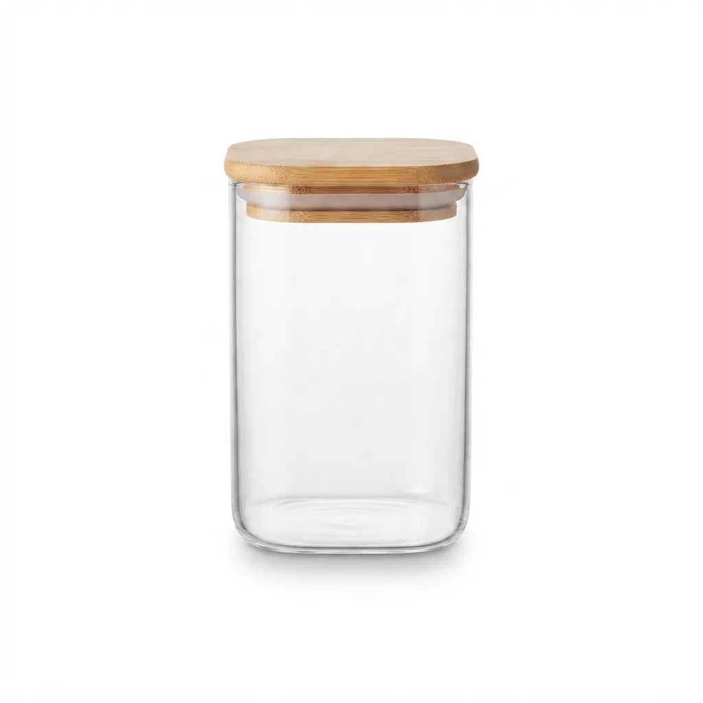 A clear glass storage jar with a light natural bamboo lid, shown on a solid white background.