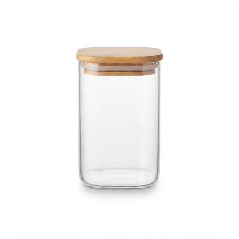 A clear glass storage jar with a light natural bamboo lid, shown on a solid white background.
