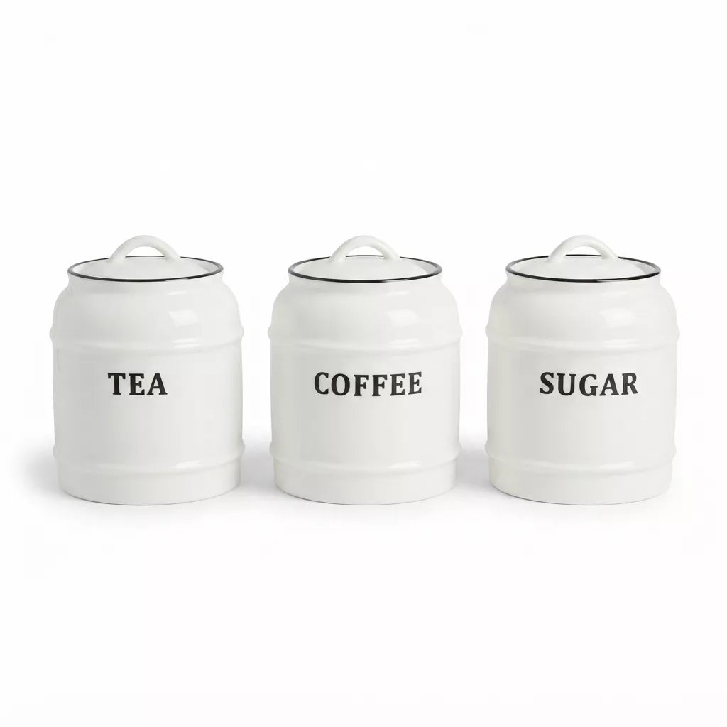 Three white ceramic canisters with lids labeled TEA, COFFEE, and SUGAR in black text, arranged side by side on a white background.