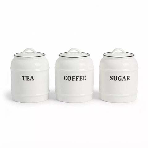 Three white ceramic canisters with lids labeled TEA, COFFEE, and SUGAR in black text, arranged side by side on a white background.
