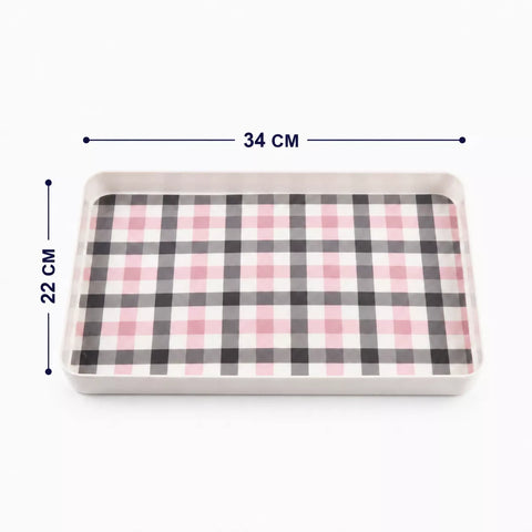 A rectangular tray with a pink, black, and white gingham plaid pattern, shown with dimension lines indicating measurements of 34 cm by 22 cm on a white background.